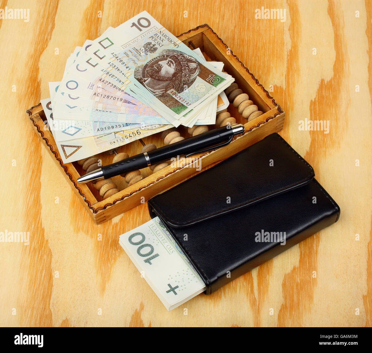 Polish money, pen, wallet and abacus Stock Photo