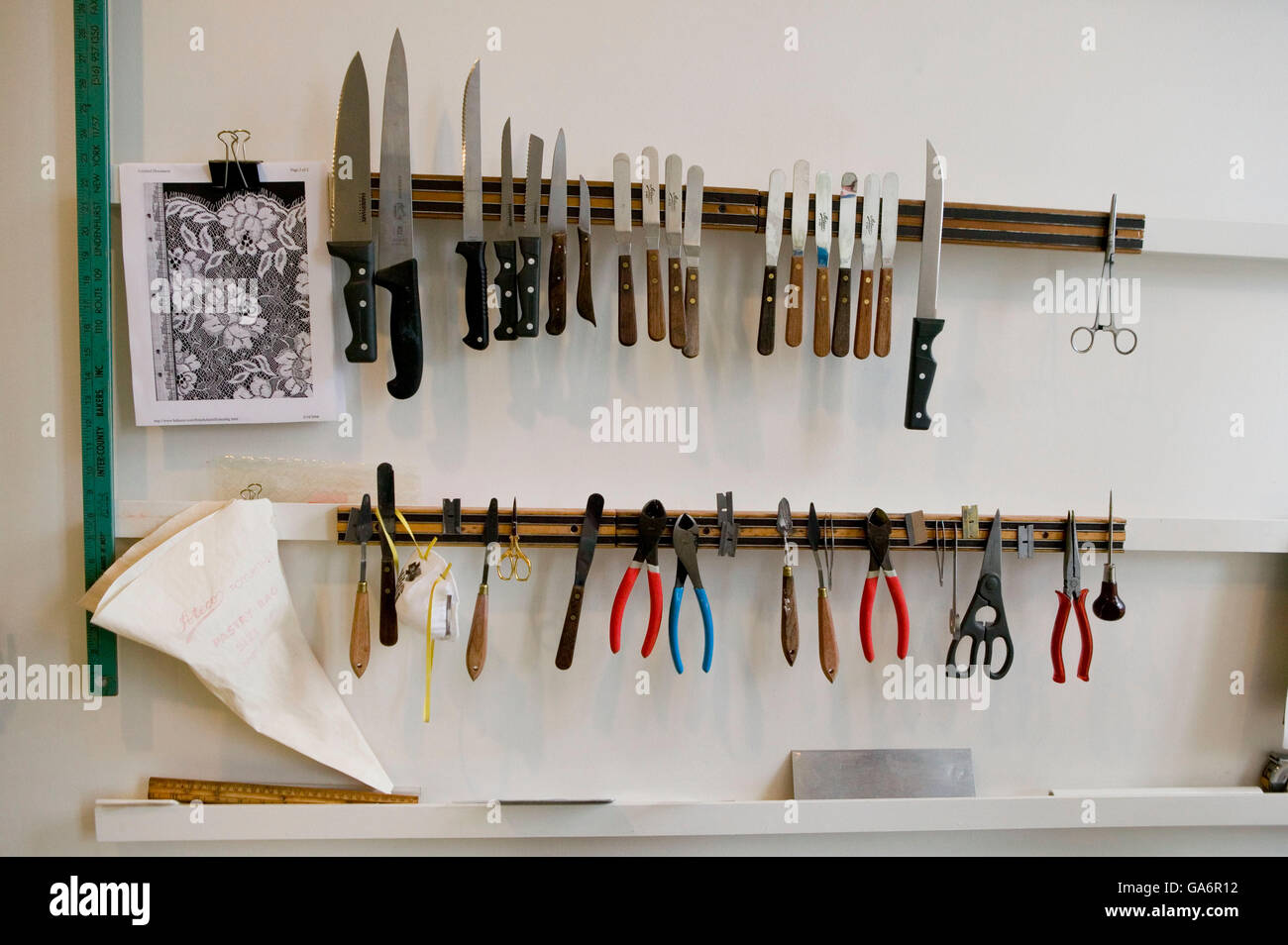 6 April 2006 - New York City, NY - View of cake decorating tools stuck to the wall at Sylvia Weinstock Cakes. Stock Photo