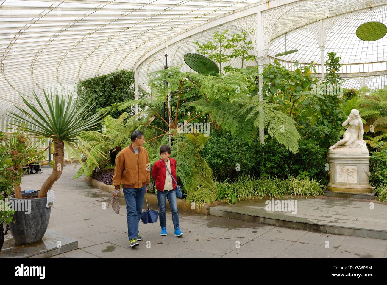 Visitors in the Kibble Palace at the Botanic Gardens in Glasgow, Scotland, UK Stock Photo