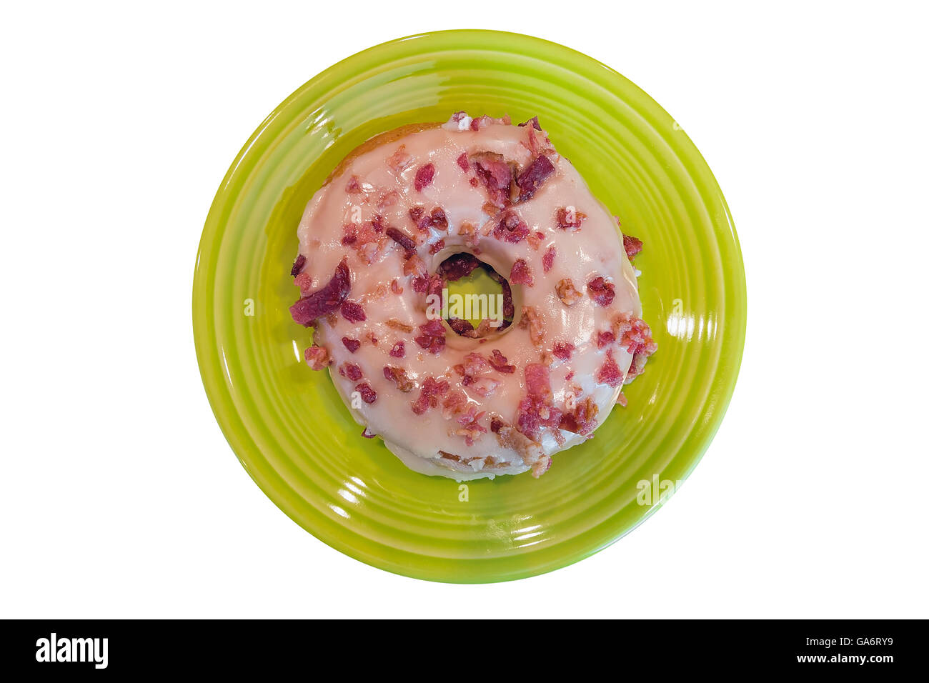 Bacon and Maple Donut on Lime Green dessert plate isolated on white background closeup macro Stock Photo