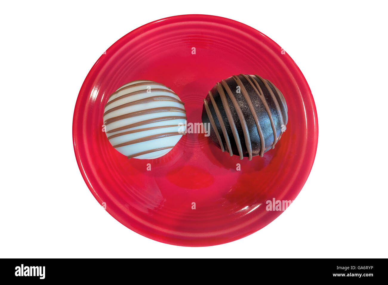 Chocolate Cupcakes on red dessert plate isolated on white background top view closeup macro Stock Photo
