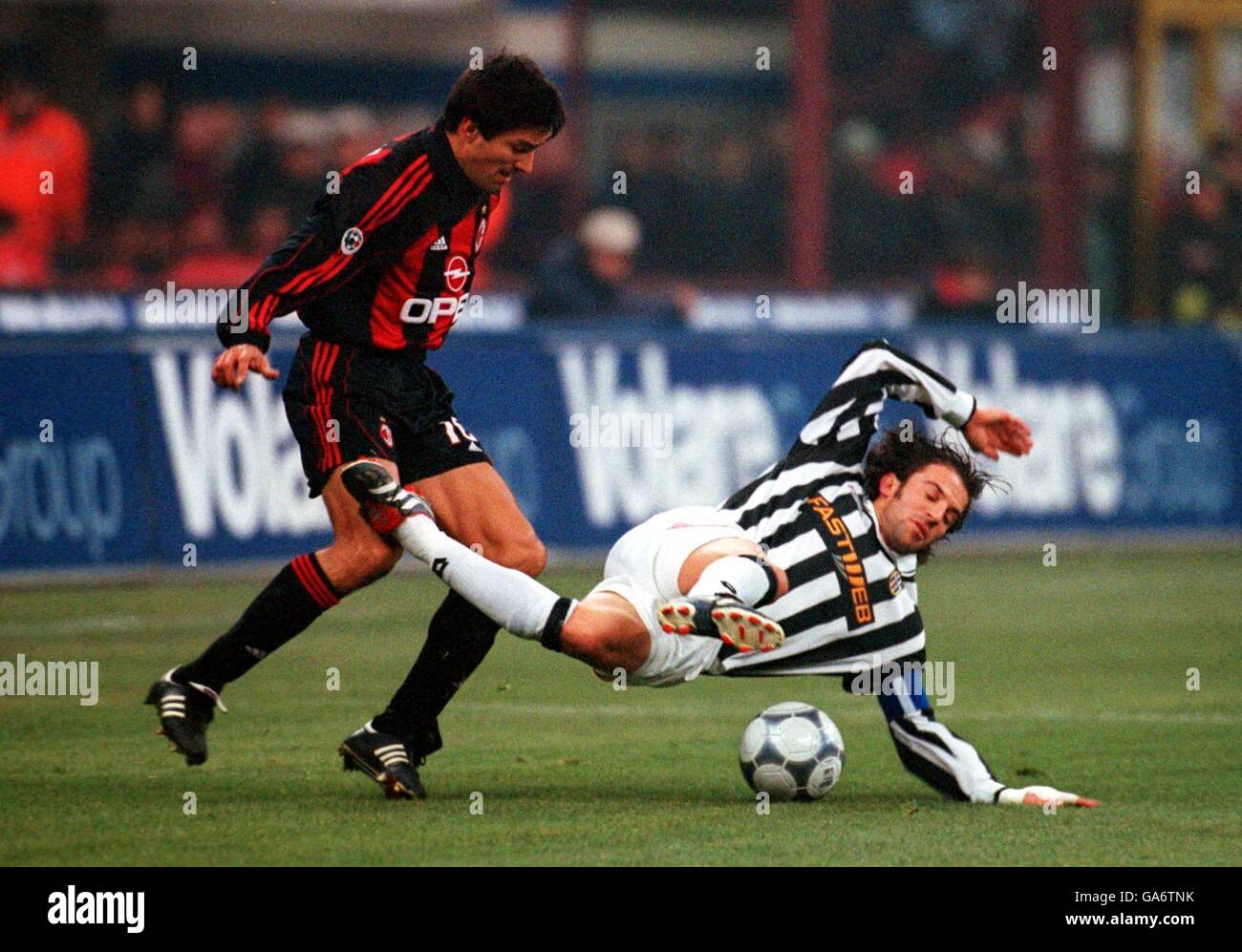 Italian Soccer -Serie A - AC Milan v Juventus. Juventus' Alessandro Del Piero (r) is sent sprawling by the challenge of AC Milan's Jose Antonio Chamot (l) Stock Photo