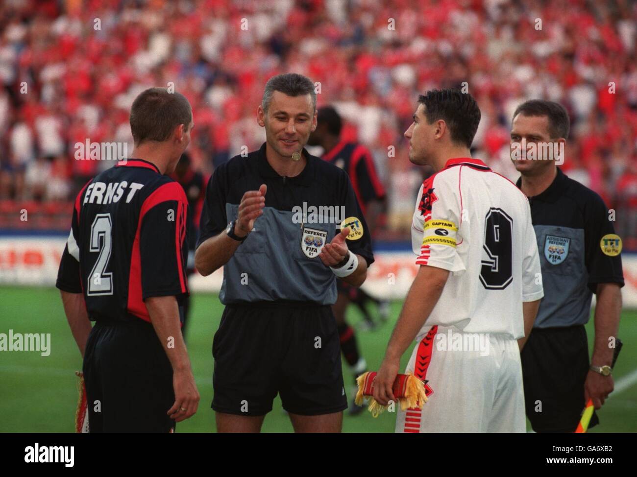 Referee Darius Miezelis (c) calls together Standard Liege captain Didier Ernst (l) and FK Vardar captain Aleksandar Bajevski (r) before the game Stock Photo