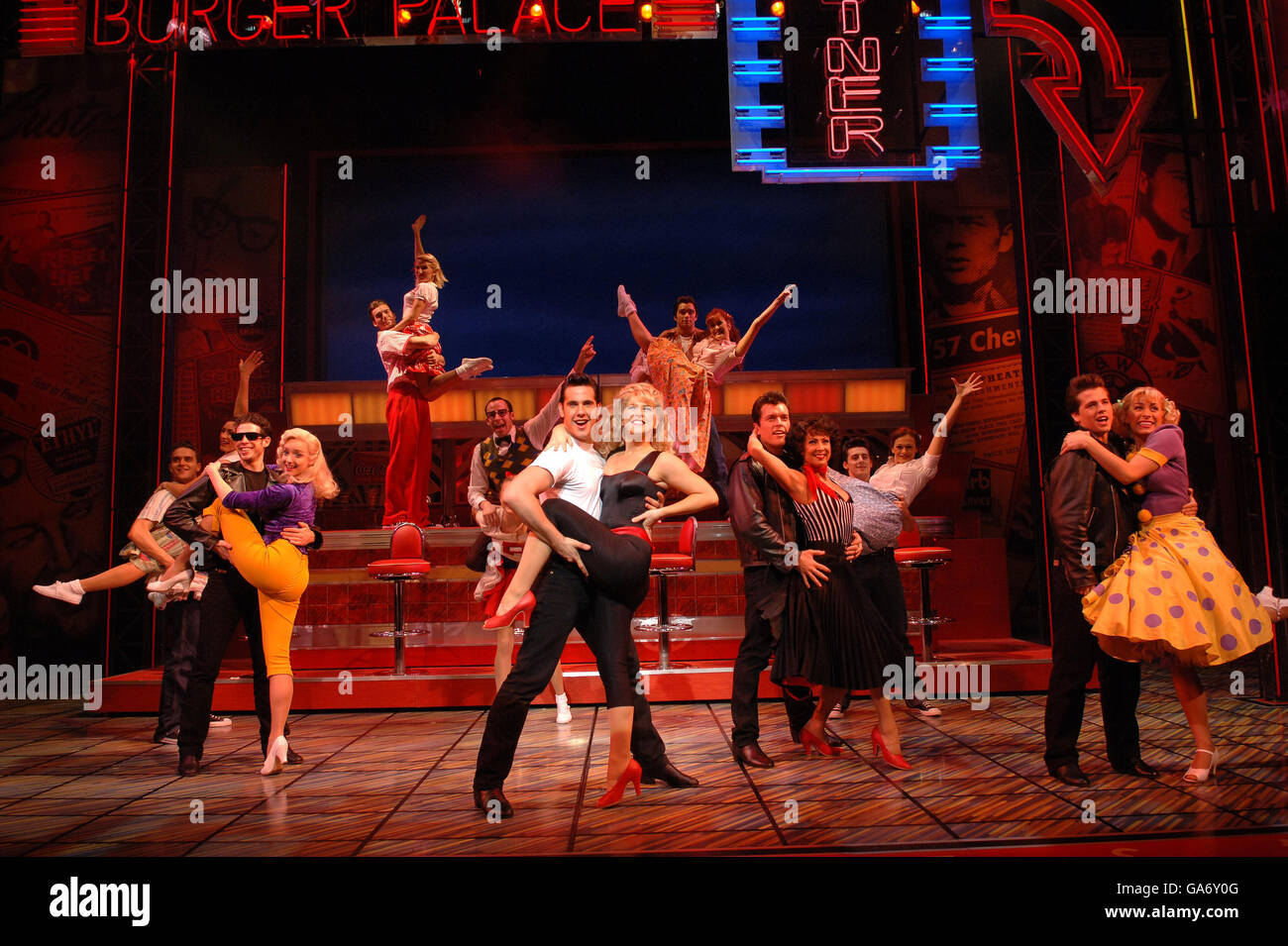 Danny Zuko and Sandy (centre) perform a scene played respectively by