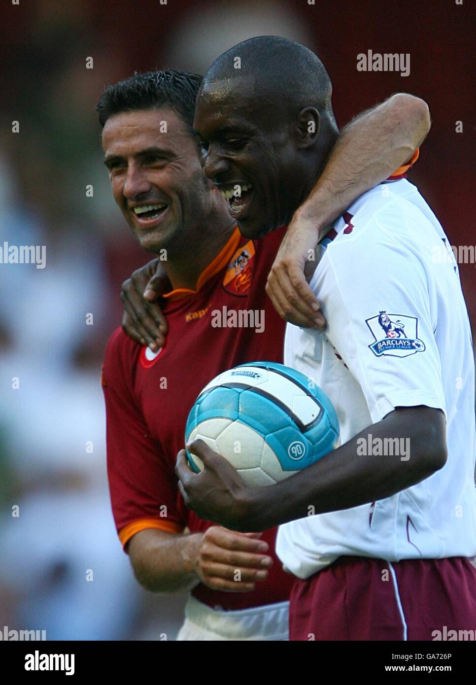 Roma's Christian Panucci (l) and West ham United's Carlton Cole share a joke at the final whistle Stock Photo