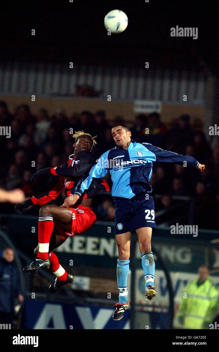 Soccer - AXA FA Cup - Third Round - Wycombe Wanderers v Fulham. Wycombe Wanderers' Danny Senda jumps against Fulham's Louis Saha Stock Photo