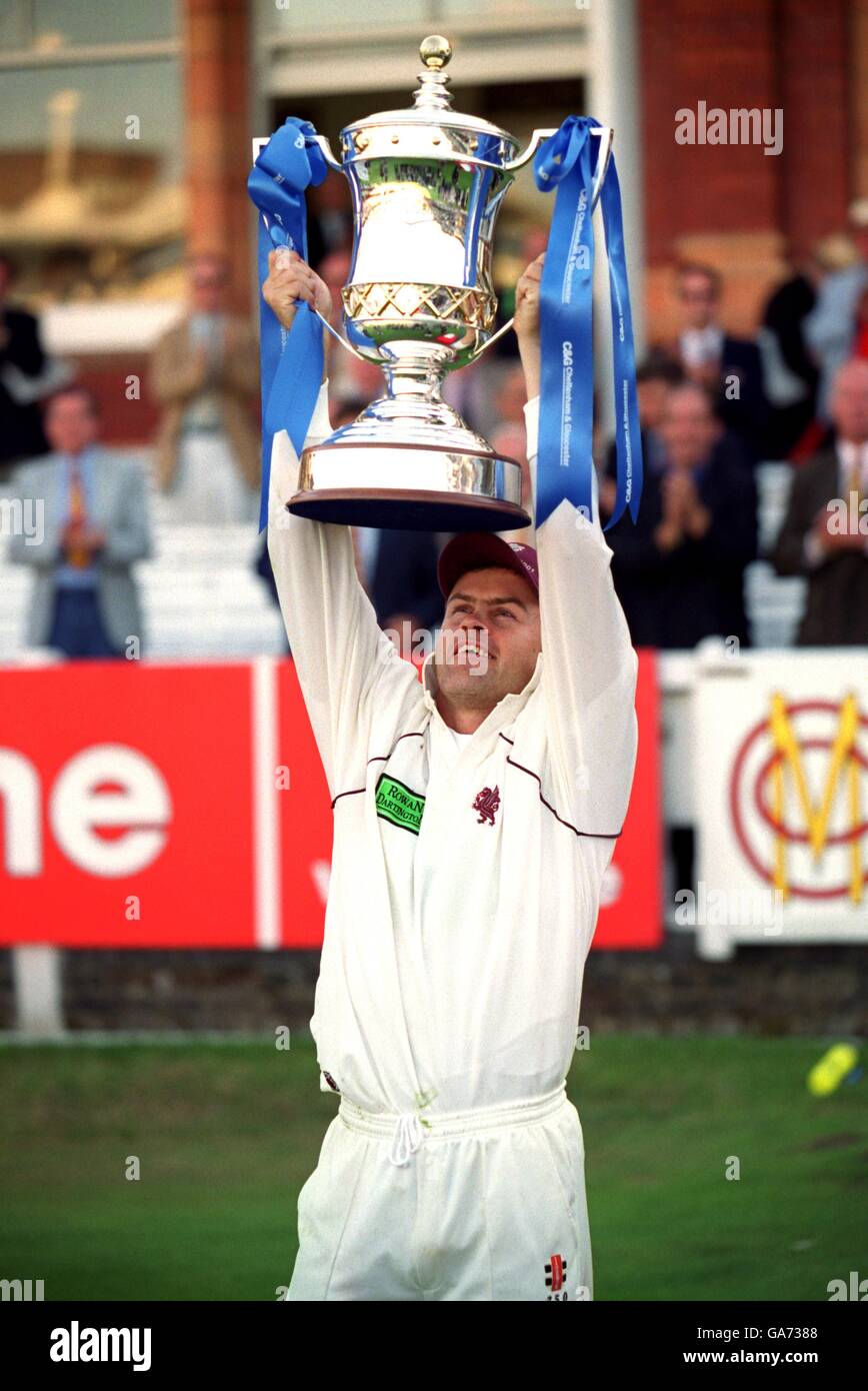 Somerset captain jamie cox holds aloft the cheltenham gloucester trophy