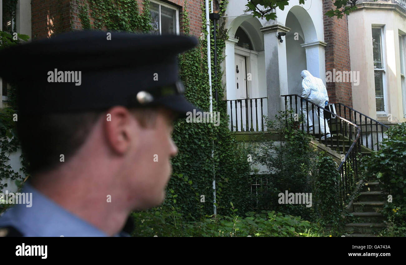 Gardai at the scene where a woman's body was found at a house on the Rathgar Road in Dublin. Stock Photo