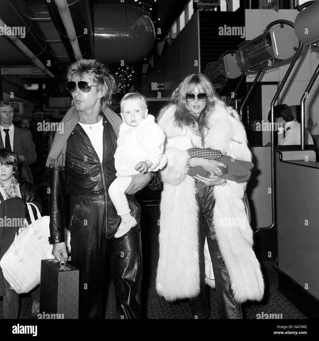 Rock star Rod Stewart with his wife Alana and daughter Kimberly, 16 months, and son Sean, three months, at heathrow Airport. Stock Photo