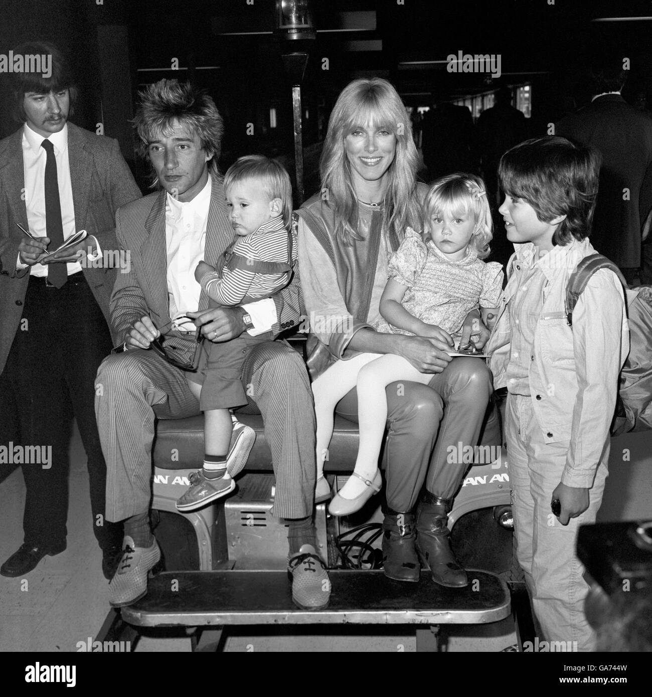 Pop singer Rod Stewart arriving from Los Angeles with his wife Alana and children Sean, 18 months (left), Kimberly, three and Ashley, six (Alana's son by her first marriage). Stock Photo