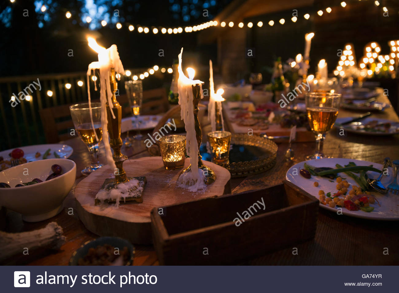 Melting Candles And Food On Wedding Reception Table Stock Photo