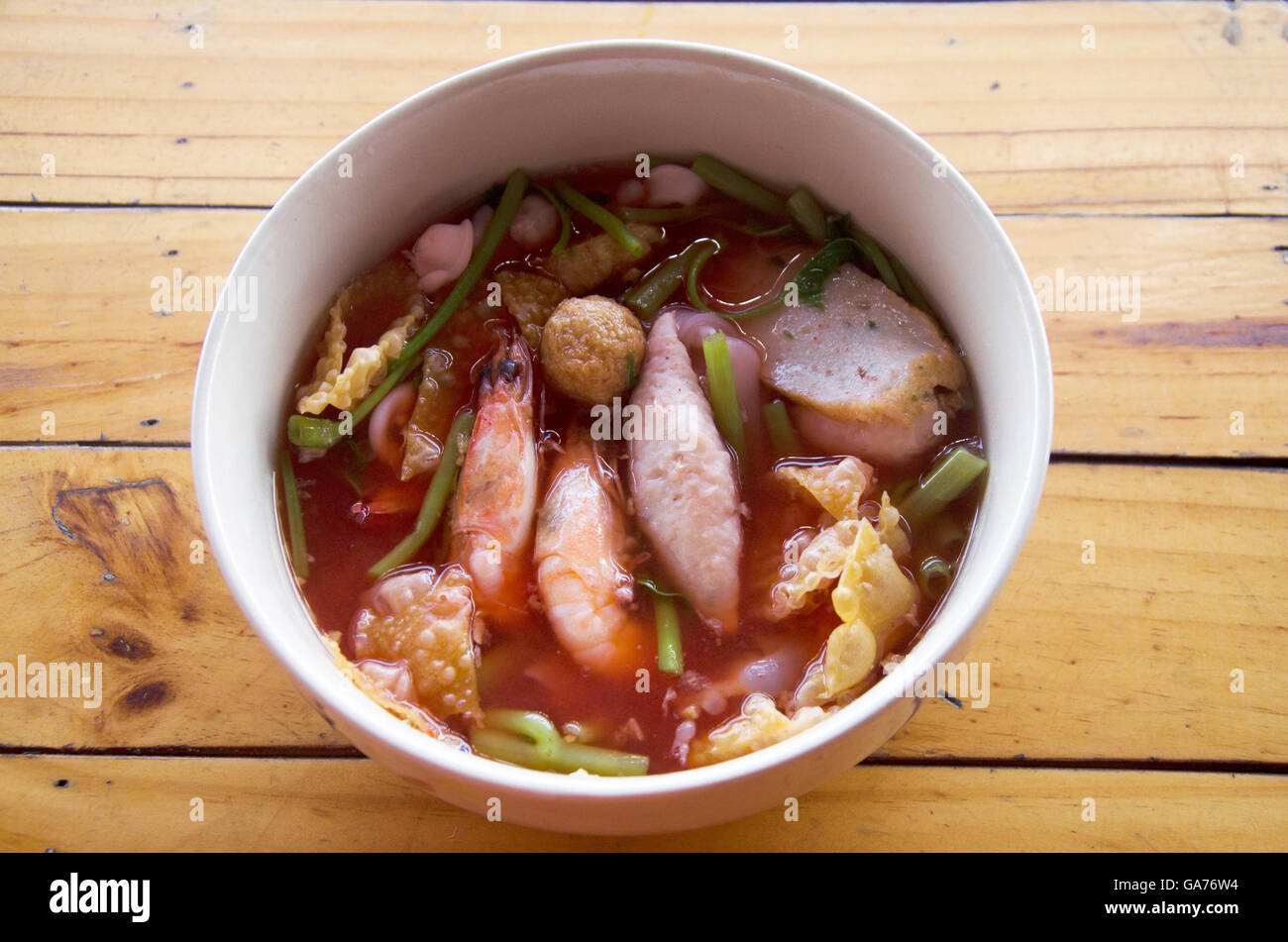 Yong tau foo or Pink seafood flat noodles called yentafo in Thailand Stock Photo