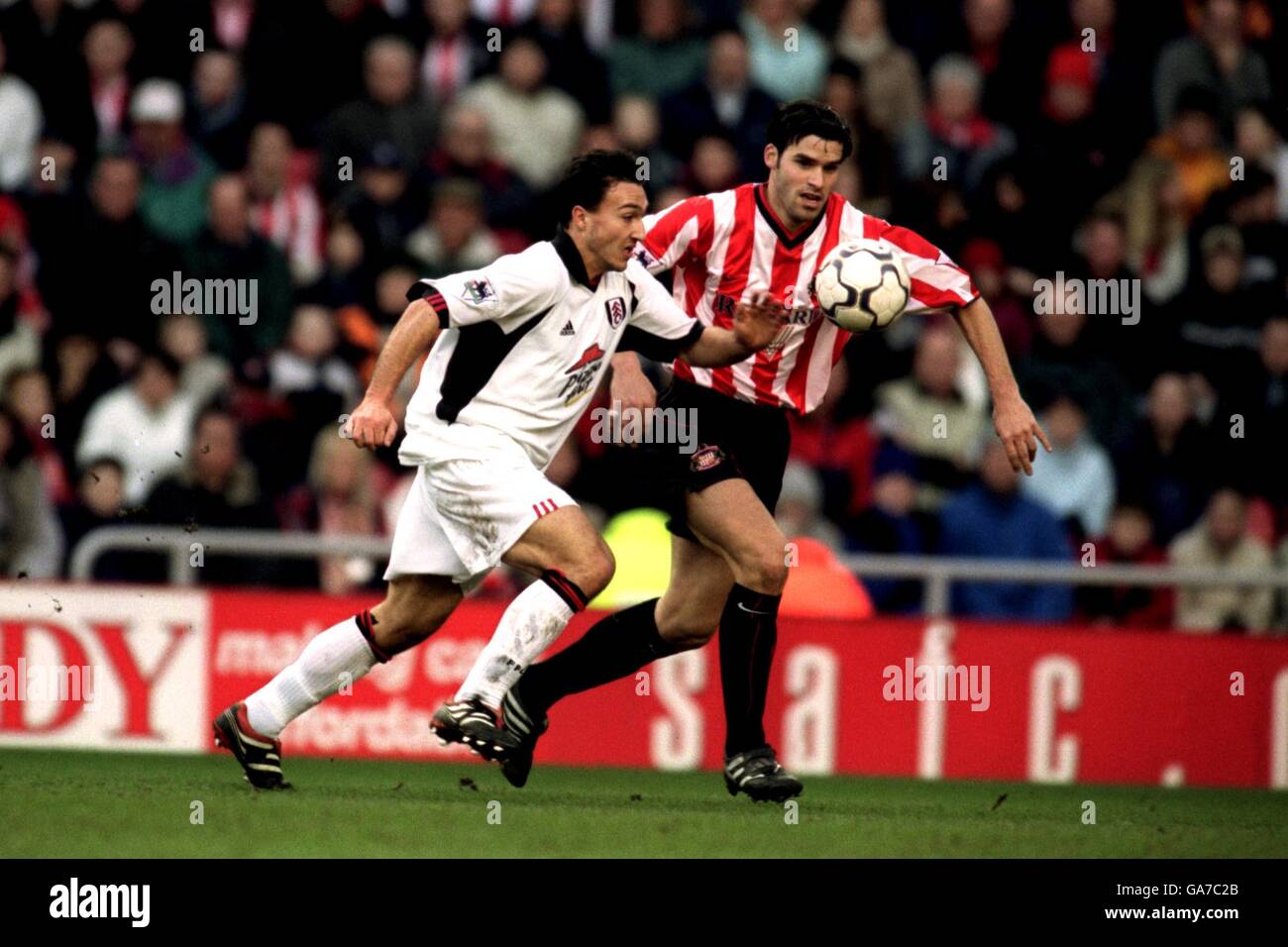 Soccer - FA Barclaycard Premiership - Sunderland v Fulham. Fulham's Steed Malbranque at Sunderland's Bernt Haas on his way to scoring the opening goal Stock Photo