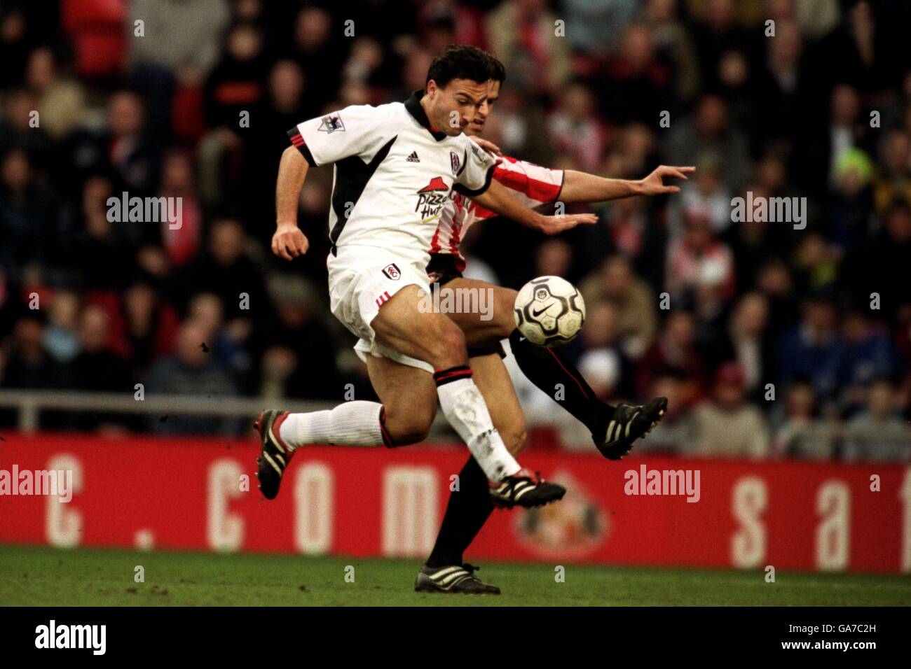 Fulham's Steed Malbranque runs past Sunderland's Bernt Haas on his way to scoring the opening goal Stock Photo