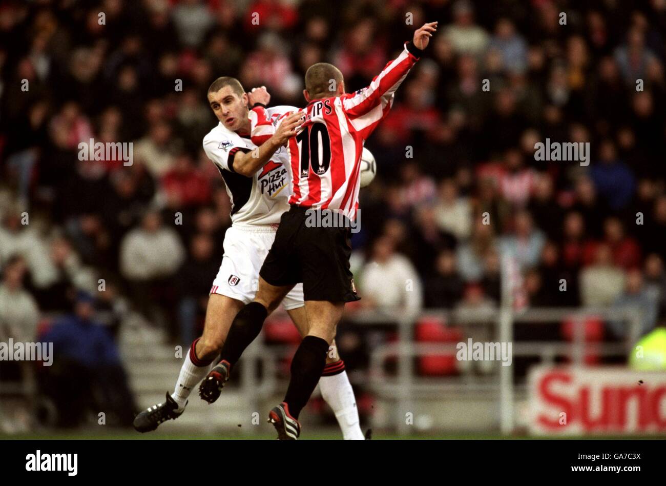 Fulham's Andy Melville battles for the ball in the air with Sunderland's Kevin Phillips Stock Photo