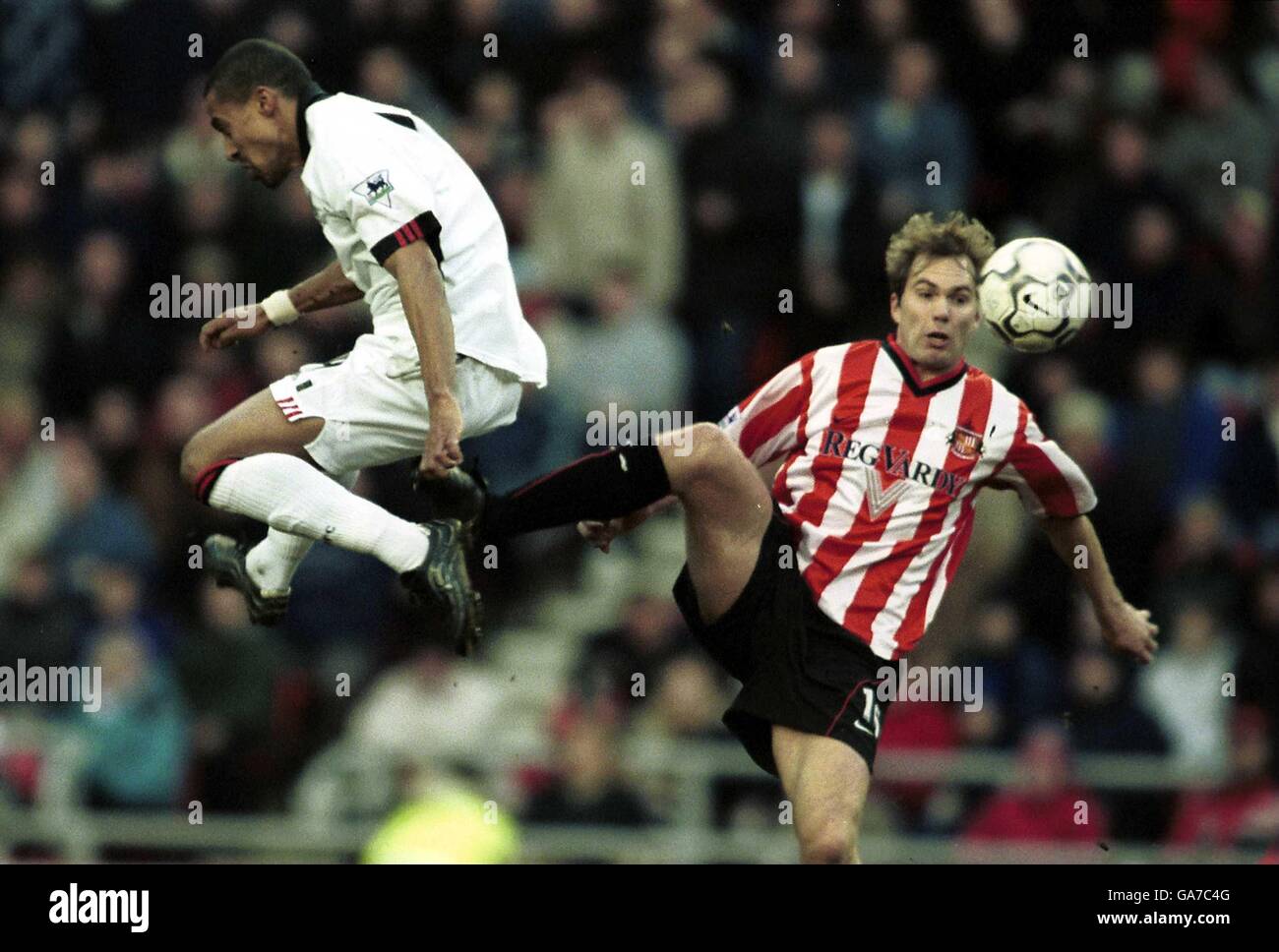 Fulham's Steve Marlet battles for the ball in the air with Sunderland's Jason McAteer Stock Photo