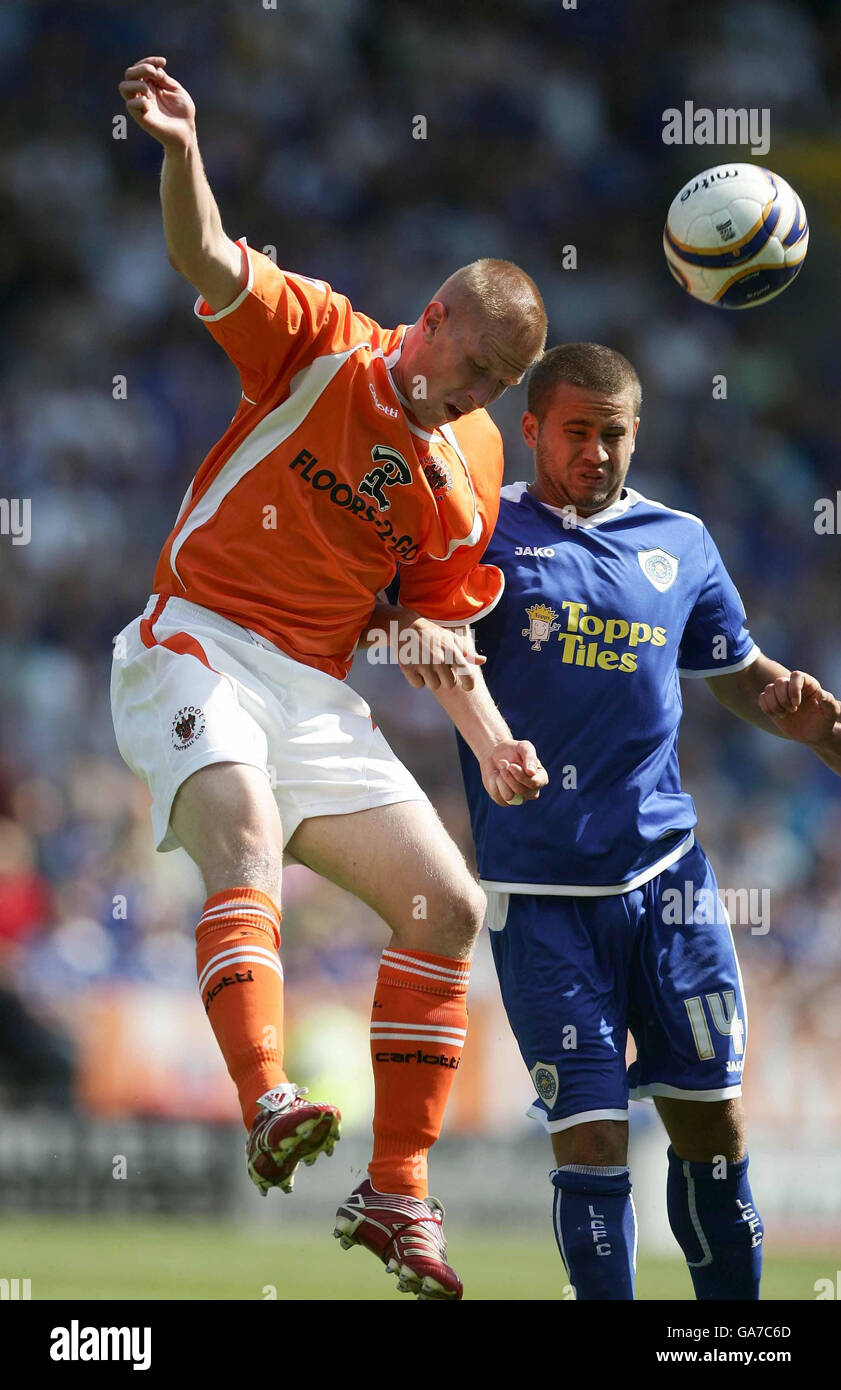Blackpool's Keith Southern and Leicester's James Wesolowski compete for the ball in an ariel challenge during the Coca-Cola Football League Championship match at The Walkers Stadium, Leicester. Stock Photo