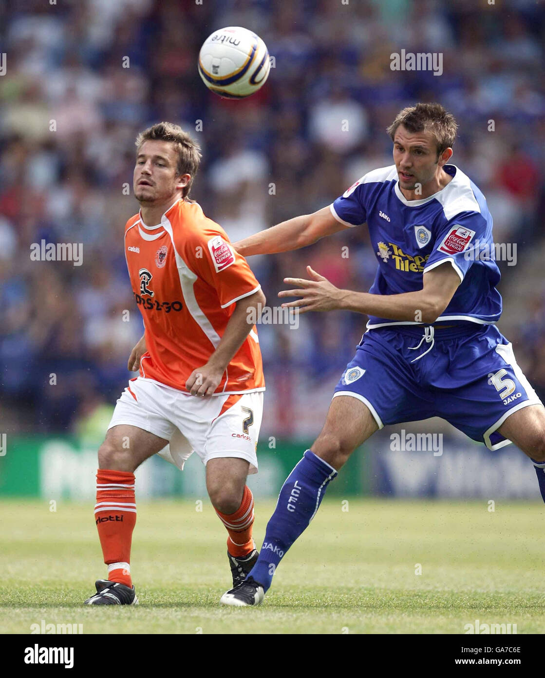 Blackpool's Keigan Parker and Leicester's Gareth McAuley both challenge for a loose ball during the Coca-Cola Football League Championship match at The Walkers Stadium, Leicester. Stock Photo