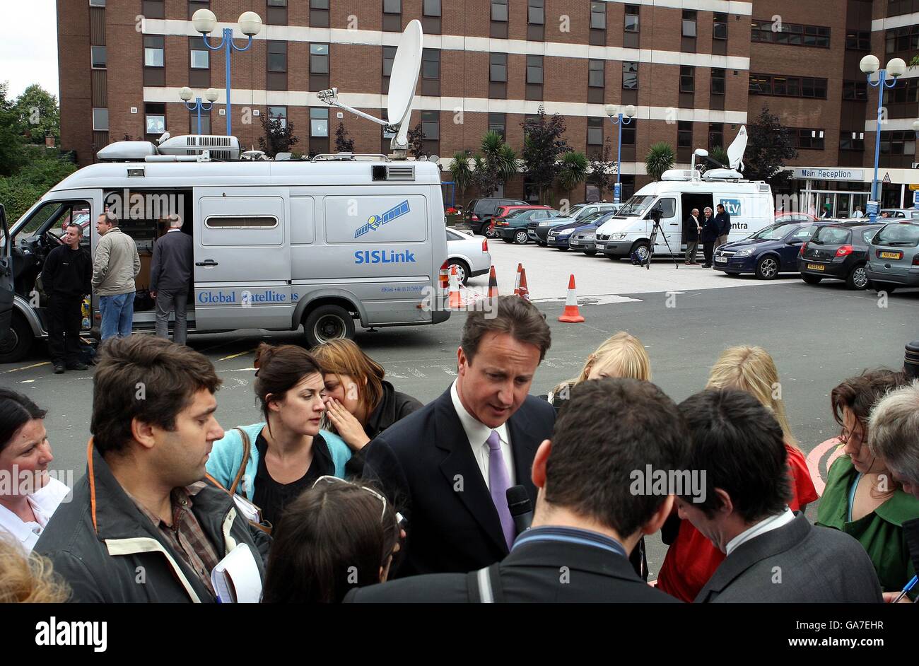 SIS Link van in the background as David Cameron is interviewed at Sandwell Hospital. Stock Photo