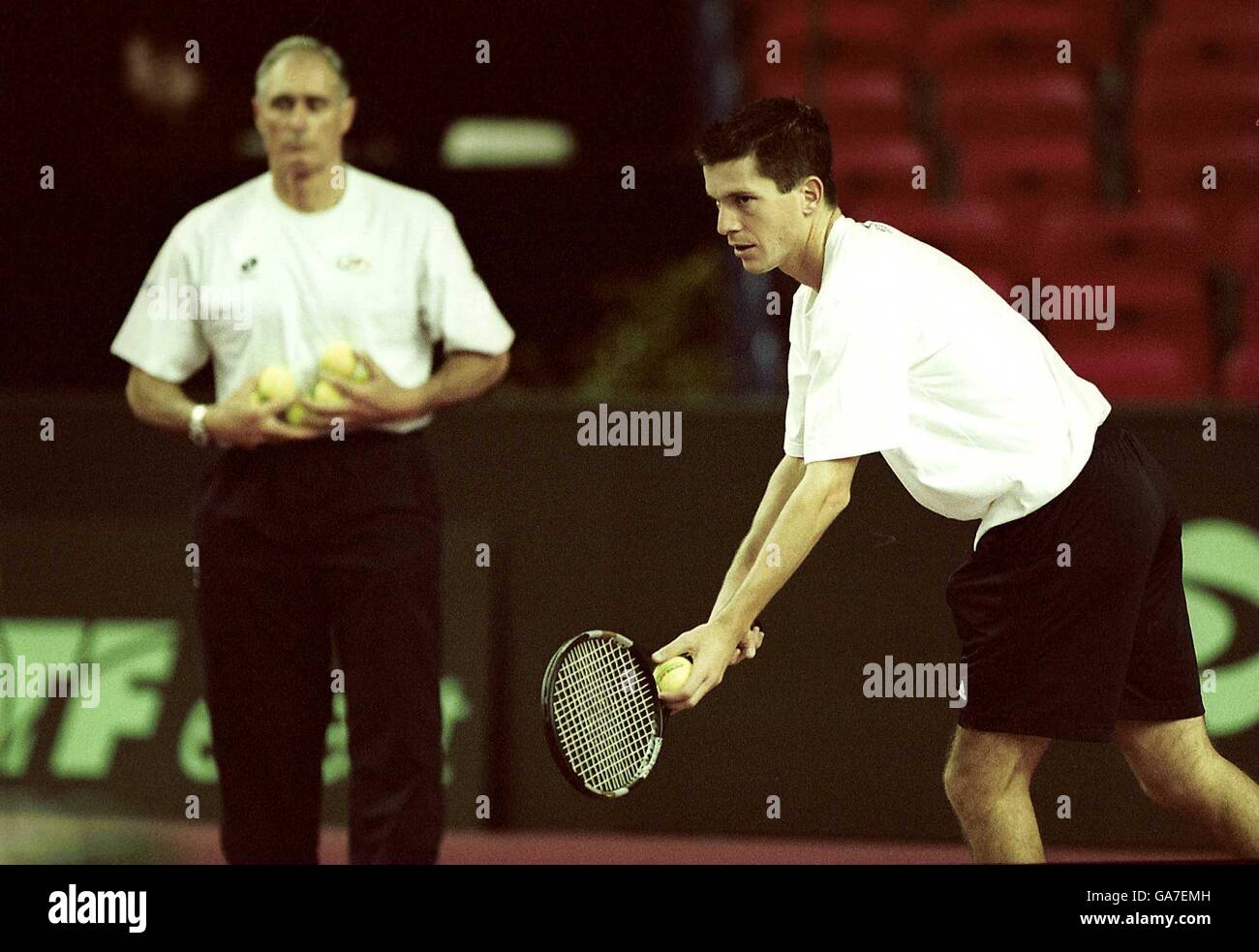 Tennis- Davis Cup World Group Round One - Great Britain v Sweden - Birmingham Indoor Arena. Great Britain's Tim Henman prepares for the Davis Cup match against Sweden watched by team Captain Roger Taylor Stock Photo