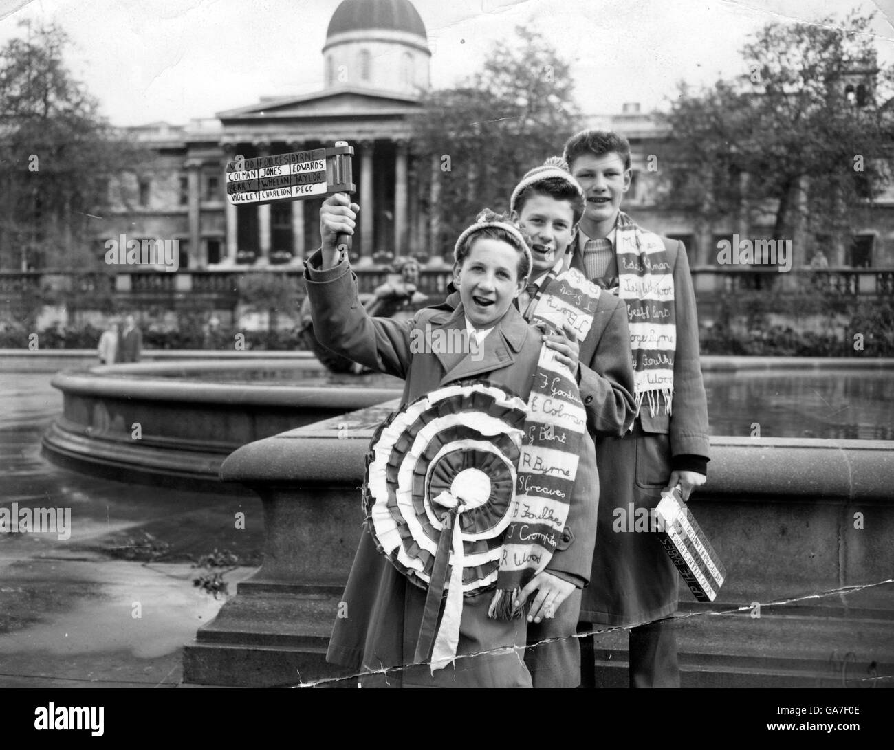 Manchester United fans in London before the Cup Final. L-R; Brian Dawson, Peter Eckersley and Peter Faulkner all travelled from Manchester with their huge rosettes, scarves and rattles. Stock Photo