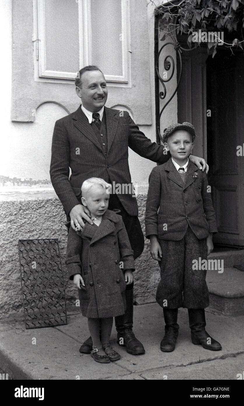 1930s, historical, Local sudeten Bohemian german land or estate owner, wearing traditional puffed-out trousers with his two sons, Lauterbach, in the Sudetenland, in pre-WW11 Czechoslovakia Stock Photo