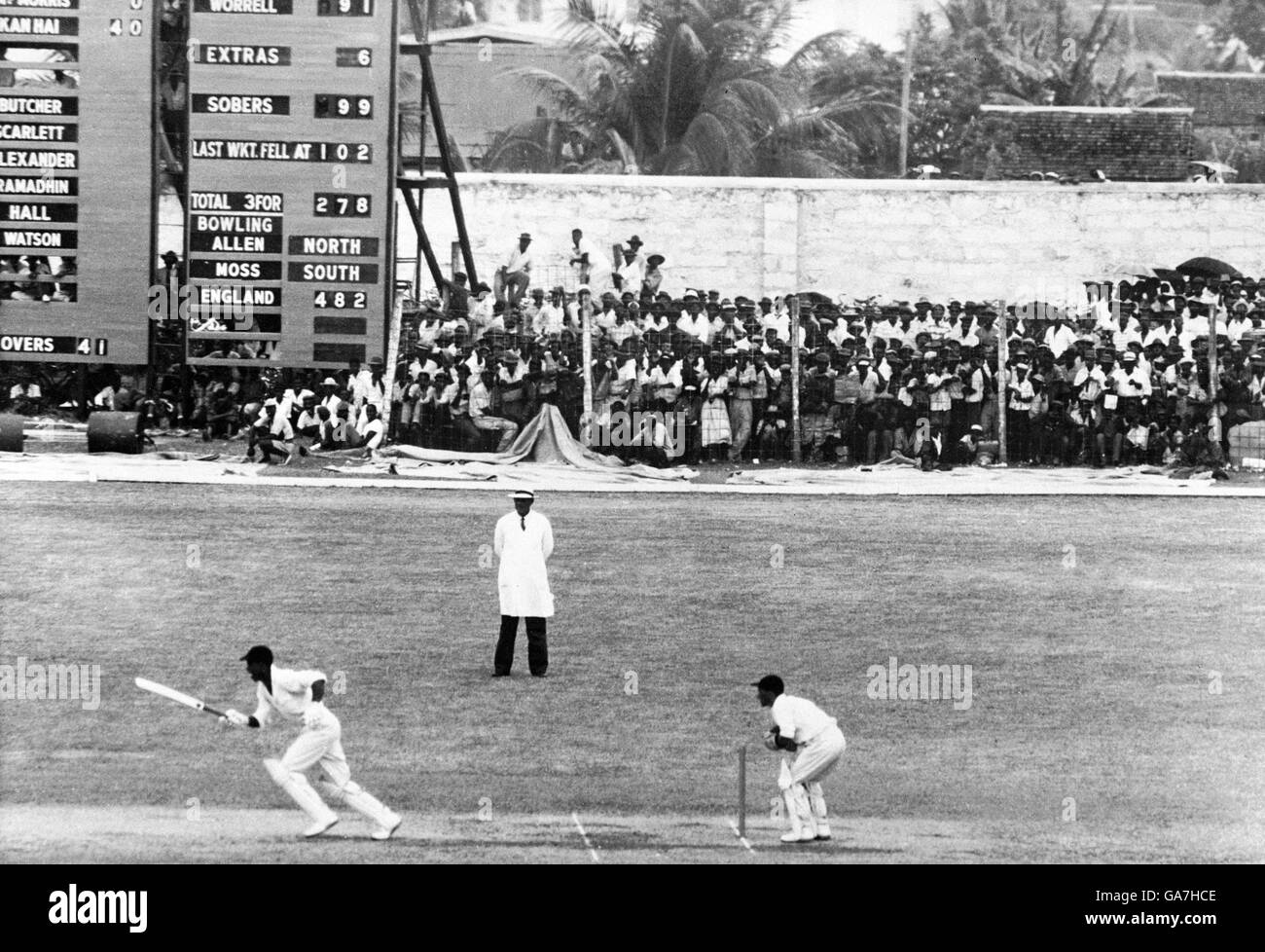 West Indies' Garfield Sobers (l) takes a single off the last ball of the day to complete his century Stock Photo