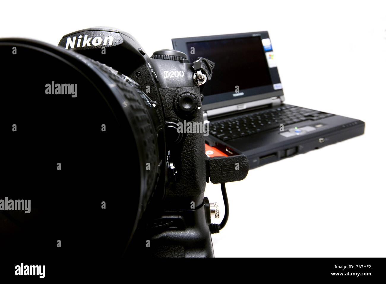 A Toshiba Libretto laptop with Nikon D200 digital SLR camera Stock Photo
