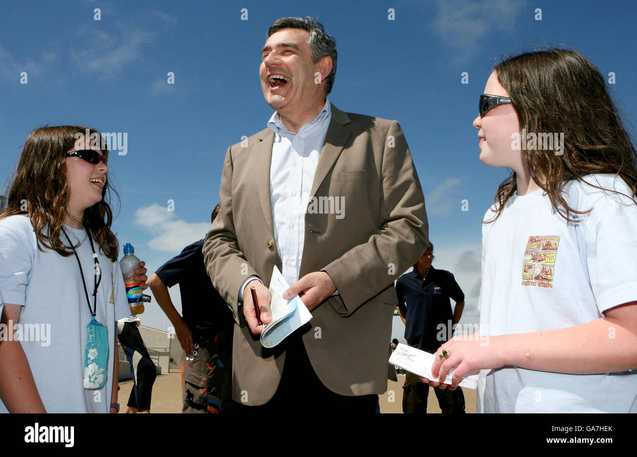 Great Britain's Prime Minister Gordon Brown meets Lucy and Sarah (right) McGowan during a visit to the Weymouth and Portland National sailing academy in Portland, Dorset. Stock Photo