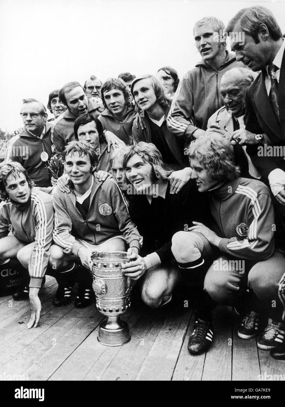 Schalke 04 celebrate with the German Cup after their 5-0 victory, featuring Rolf Russman (top, second r), Klaus Fischer (back row, third l), goalkeeper Norbert Nigbur (front row, second r) and Reinhard Libuda (front row, second l) Stock Photo