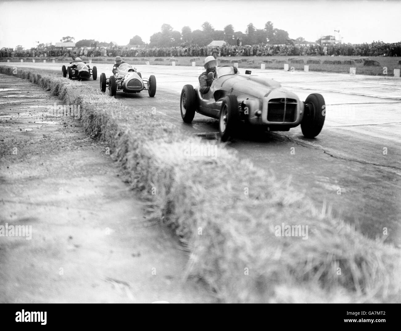 (R-L) Stirling Moss, in his ERA, leads from Alan Brown's Cooper Bristol Stock Photo