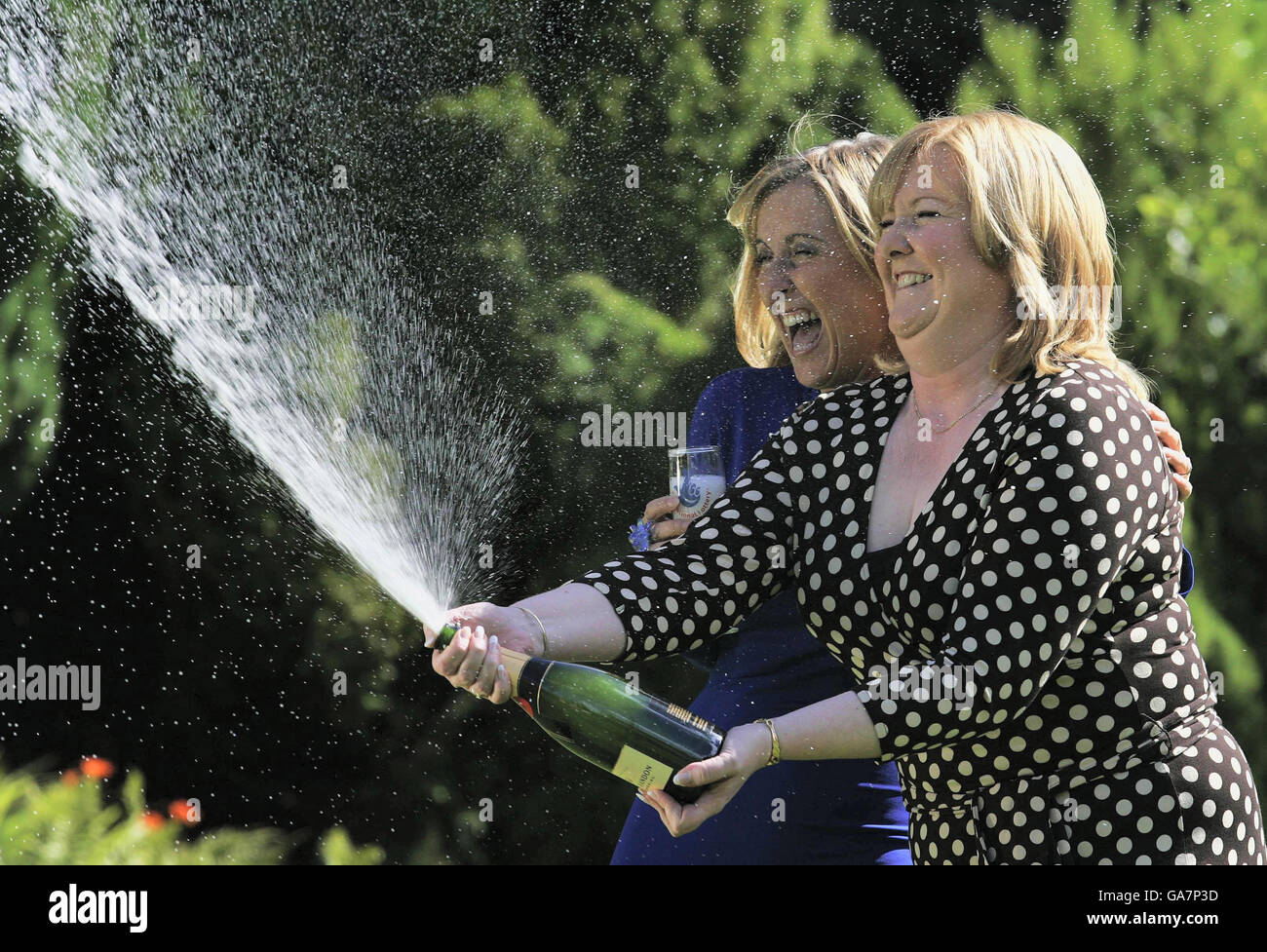 Angela Kelly who was unveiled today as the winner of the UK's biggest lottery jackpot celebrates with TV presenter Fiona Phillips following a press conference at Airth Castle Hotel, in Falkirk. Stock Photo