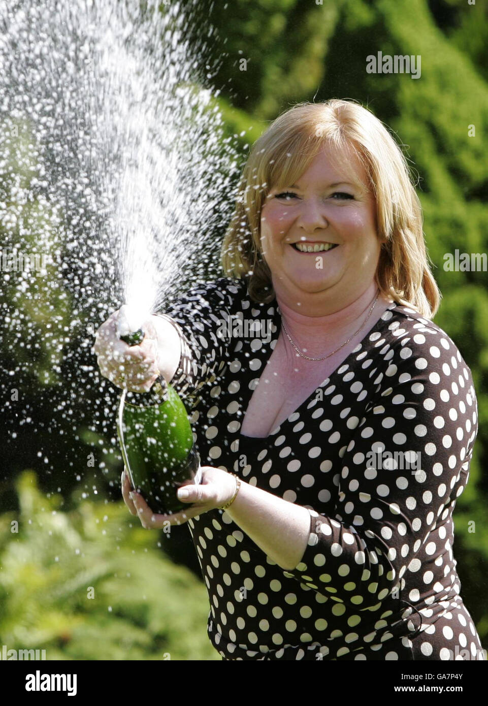 Angela Kelly, aka Angela Cunningham, who was unveiled today as the winner of the UK's biggest lottery jackpot celebrates following a press conference at Airth Castle Hotel, in Falkirk. Stock Photo