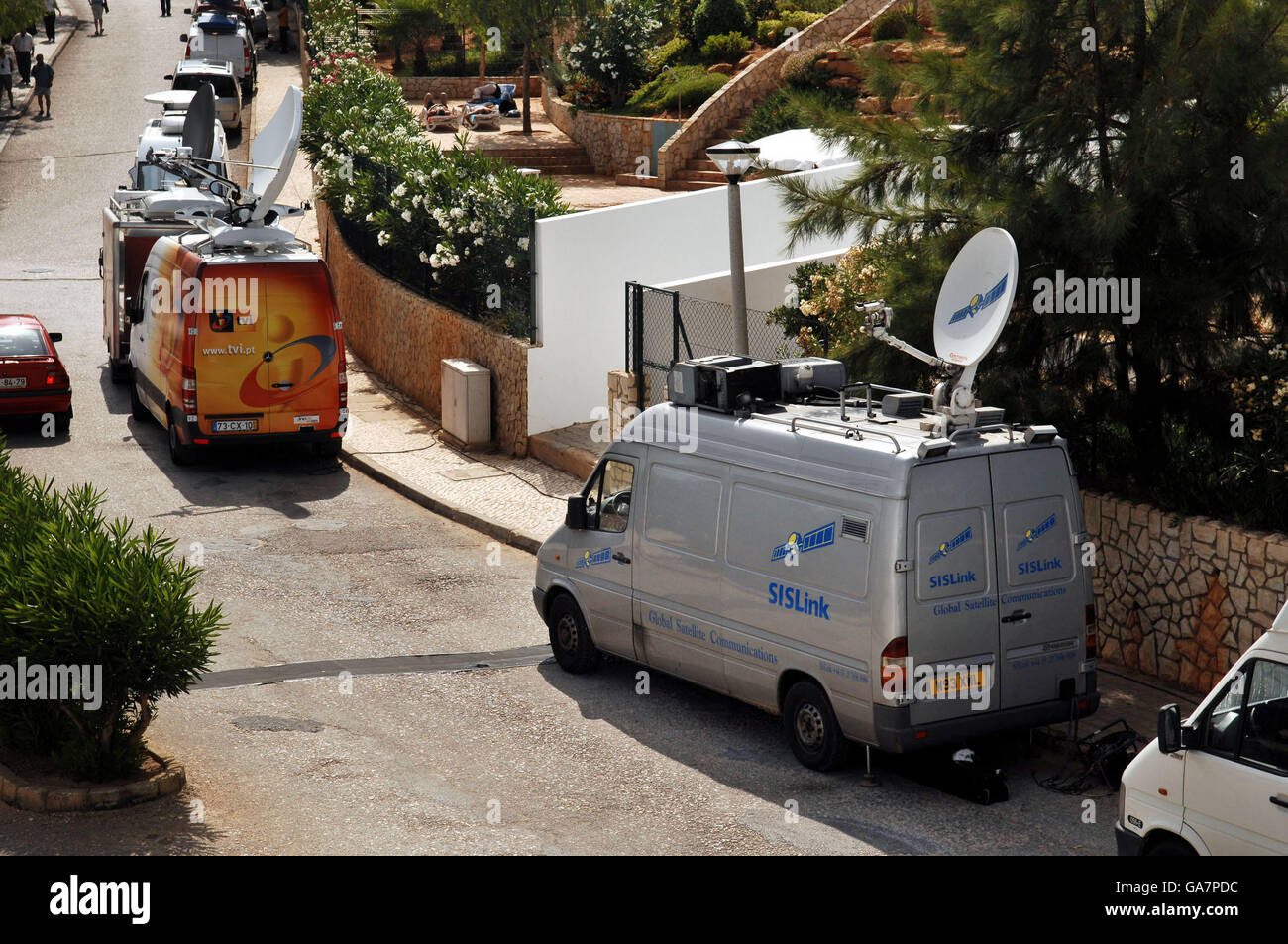 Vans from SIS Link join other Television news channel vans from all over  the world parked outside the apartment in Praia Du Luz, Portugal, where  Madeleine McCann went missing on May 3rd