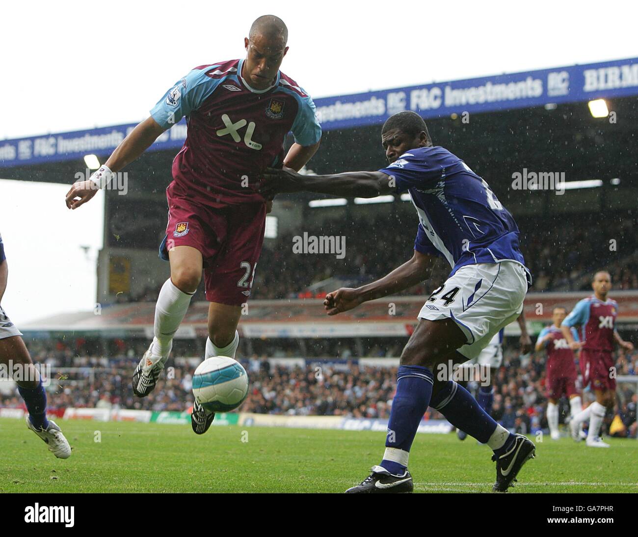 West Ham United's Bobby Zamora and Birmingham City's Radhi Jaidi battle for the ball Stock Photo