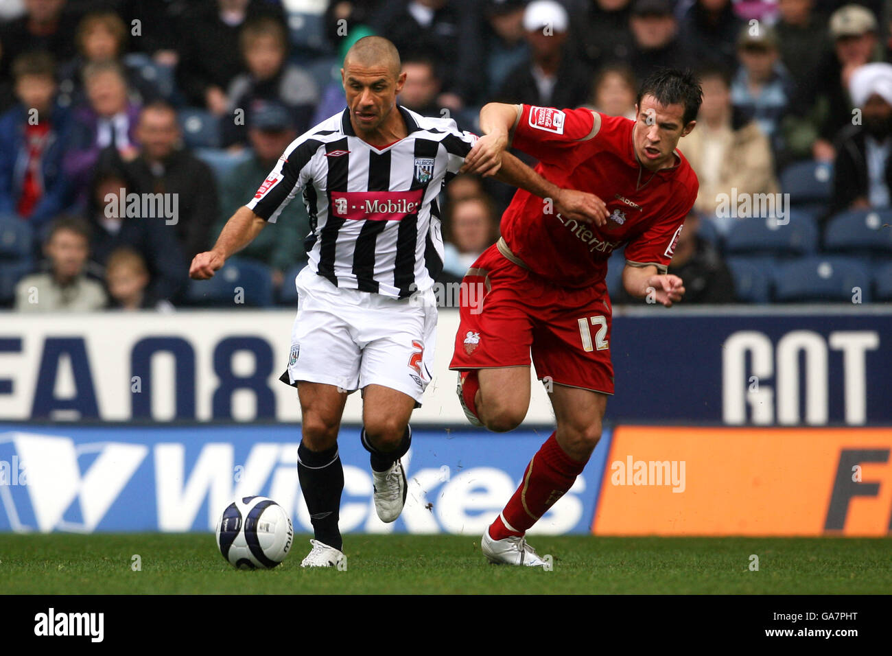 West Bromwich Albion's Kevin Phillips and Preston North End's Sean St. Ledger during the Coca-Cola Football League Championship match at The Hawthorns, West Bromwich. Stock Photo