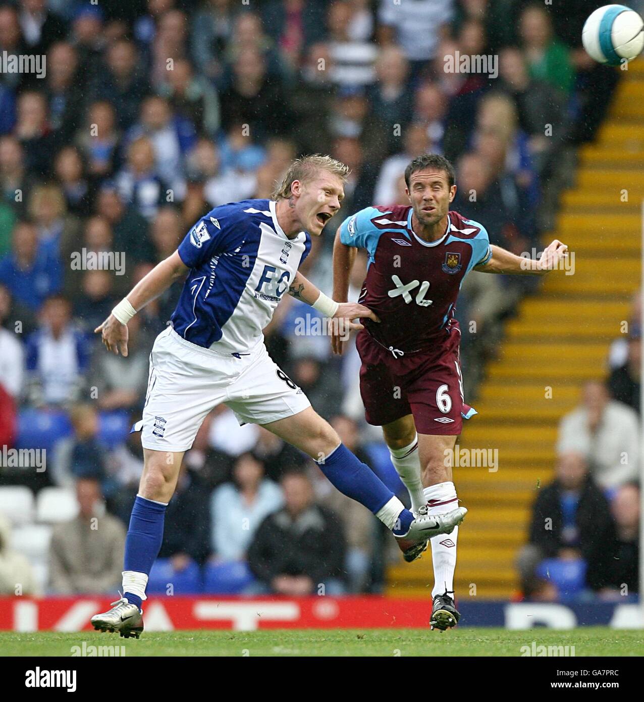 Soccer - Barclays Premier League - Birmingham City v West Ham United - St Andrews. Birmingham City's Garry O'Connor and West Ham United's Matthew Upson battle for the ball Stock Photo