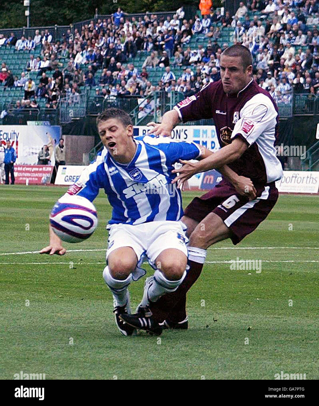 Brighton's Alex Revell is bought down by Northampton's Chris Doig for a penalty during the Coca-Cola Football League One match at the Withdean Stadium, Brighton. Stock Photo