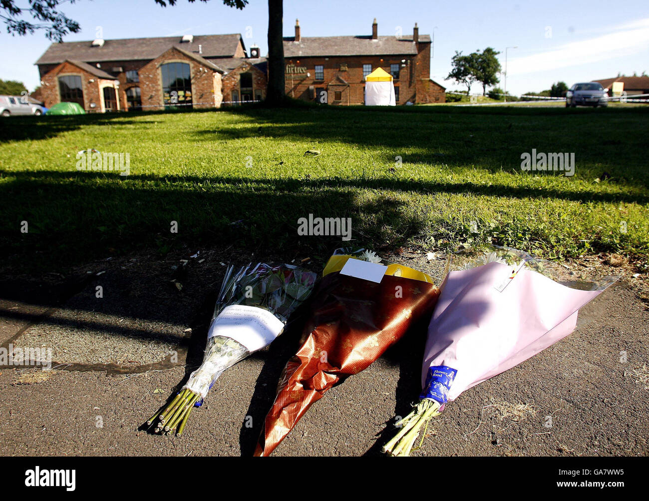 Flowers laid at the scene outside outside the Fir Tree pub in Croxteth