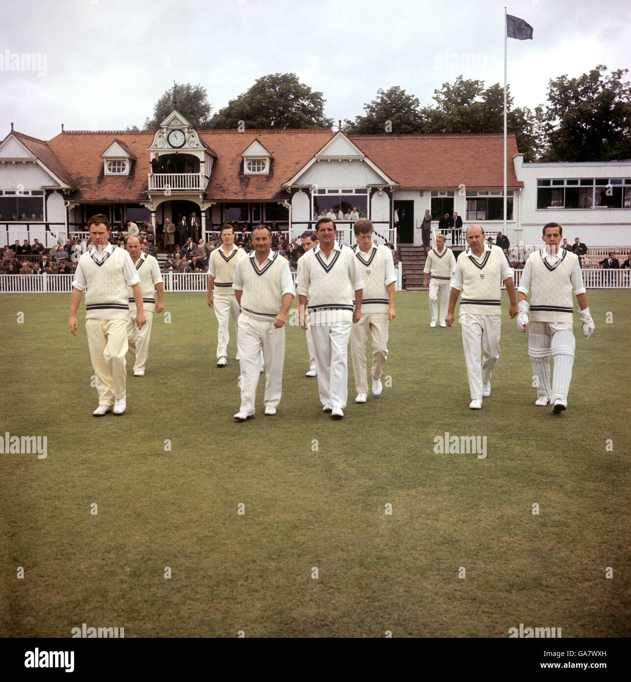 Cricket - Worcestershire County Cricket Club - Photocall. Club captain D. Kenny leads out the Worcester team. Circa 01/07/1956 Stock Photo