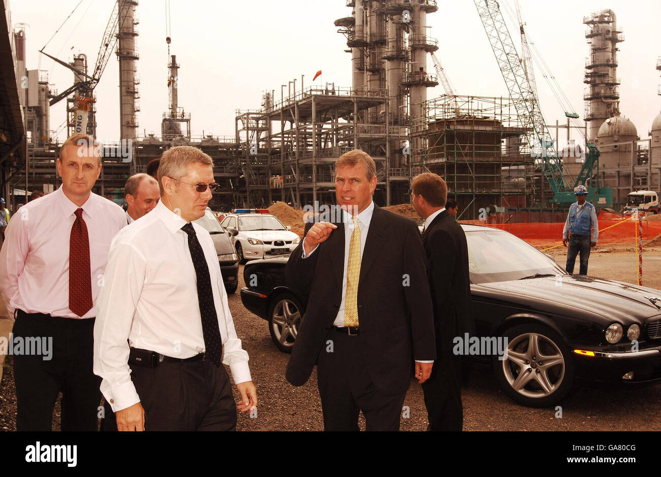The Duke of York, who is the UK special representative for Trade and Investment, talks to Geoff Muir (glasses) senior project manager at the building of the British Company Lucite International perspex plant, being constructed on Jurong Island Singapore. Stock Photo