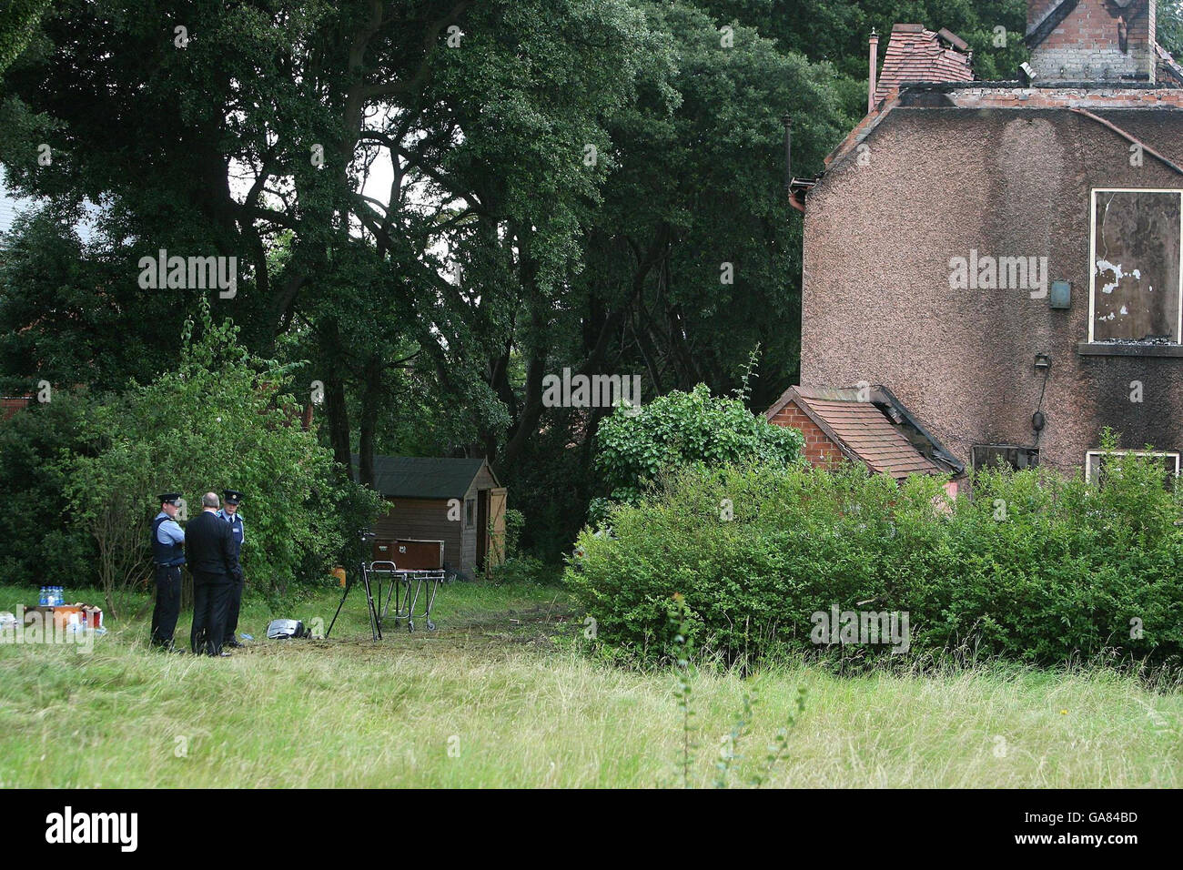 A coffin at the scene in Clontarf , Dublin, where a body was found at a burned out derelict house. Stock Photo