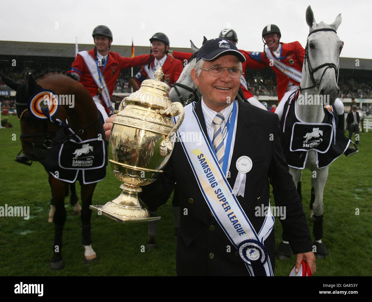 Germany's Chef d'Equipe Sonke Sonksen (front) and team (left to right) Thomas Muhlbauer, Engemann Hermann, Holger Wulschner and Thomas Voss hold up the Aga Khan Challenge trophy at the Dublin Horse Show at the RDS, Dublin. Stock Photo
