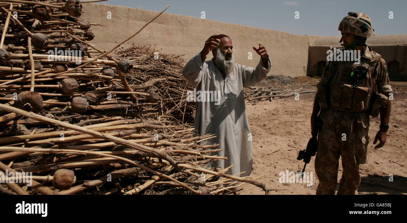 Photo. Colour Sergeant Marco Zecca from B company of the Worcester and Sherwood Forest regiment talks to locals in the Helmand provence, Southern Afghanistan. Stock Photo