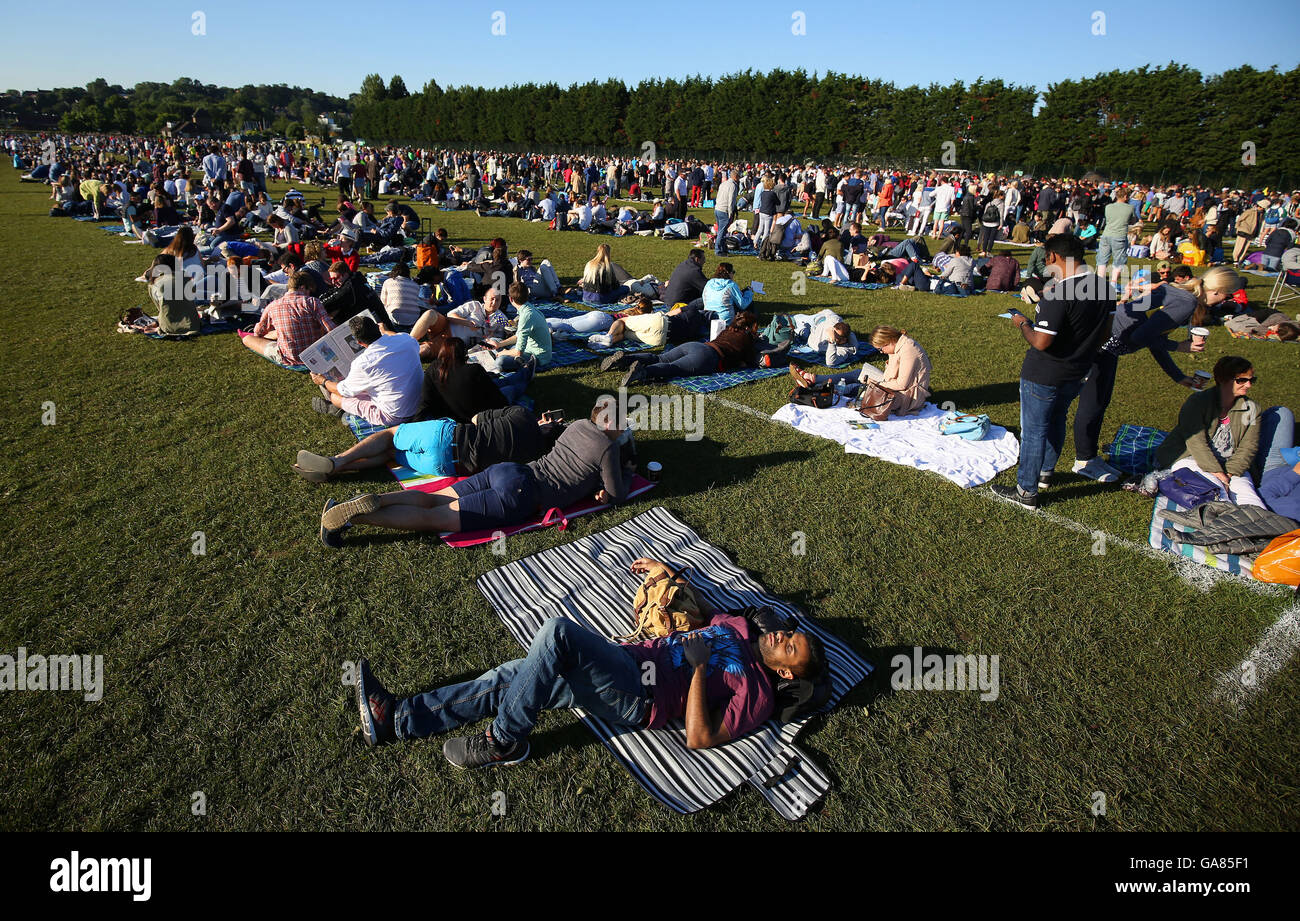 Spectators queue in Wimbledon Park on day eight of the Wimbledon ...