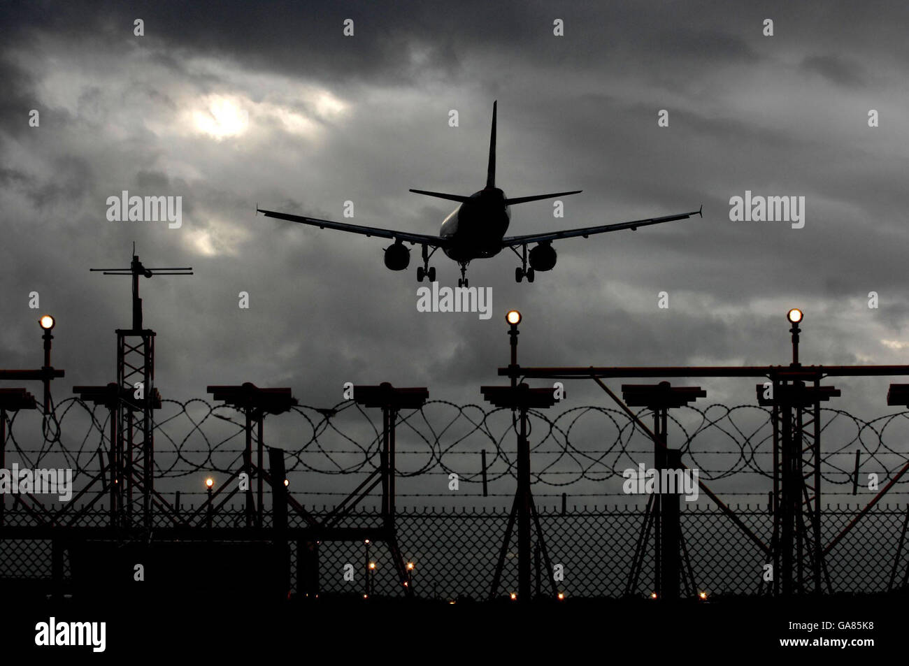 Climate change camp at Heathrow. A plane lands at Heathrow Airport. Stock Photo