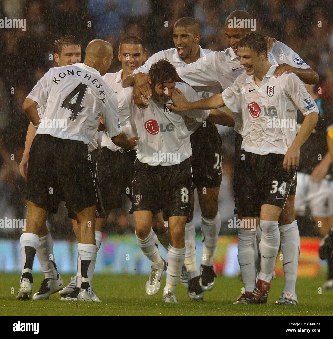 Soccer - Barclays Premier League - Fulham v Bolton Wanderers - Craven Cottage. Fulham's Alexey Smertin (no.8) is congratulated on scoring his sides second goal of the game. Stock Photo