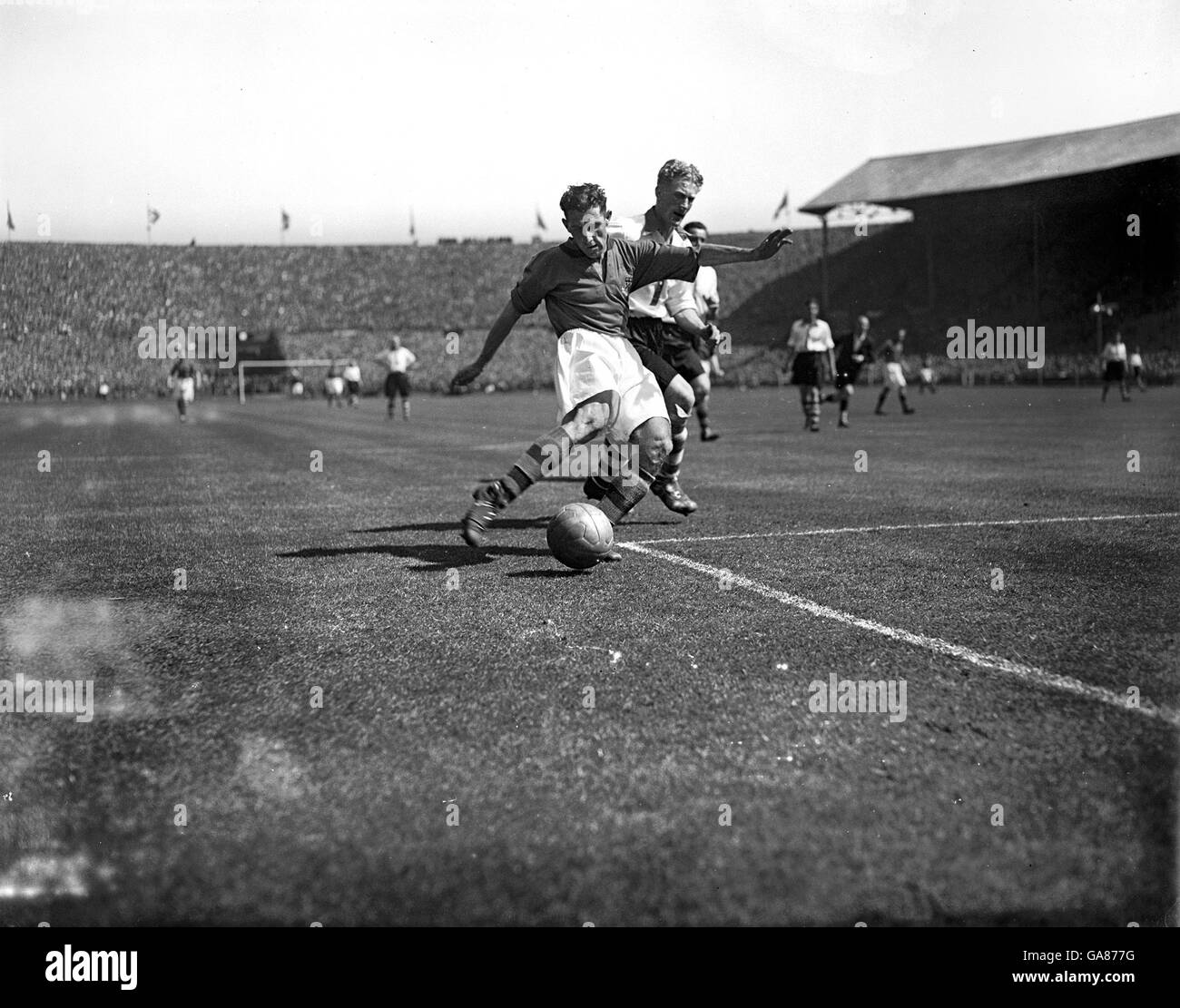 Ray Harrison, the Burnley centre forward takes a shot at goal during the first half of the Cup Final against Charlton at Wembley. Stock Photo