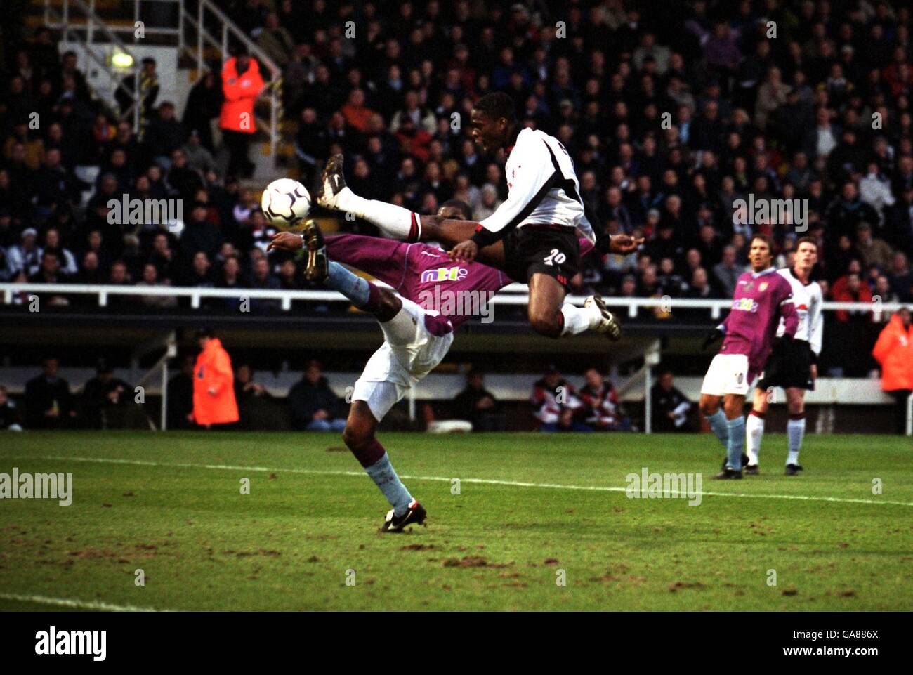 Fulham's Louis Saha fails to score from a good chance under pressure from Aston Villa's Jlloyd Samuel Stock Photo
