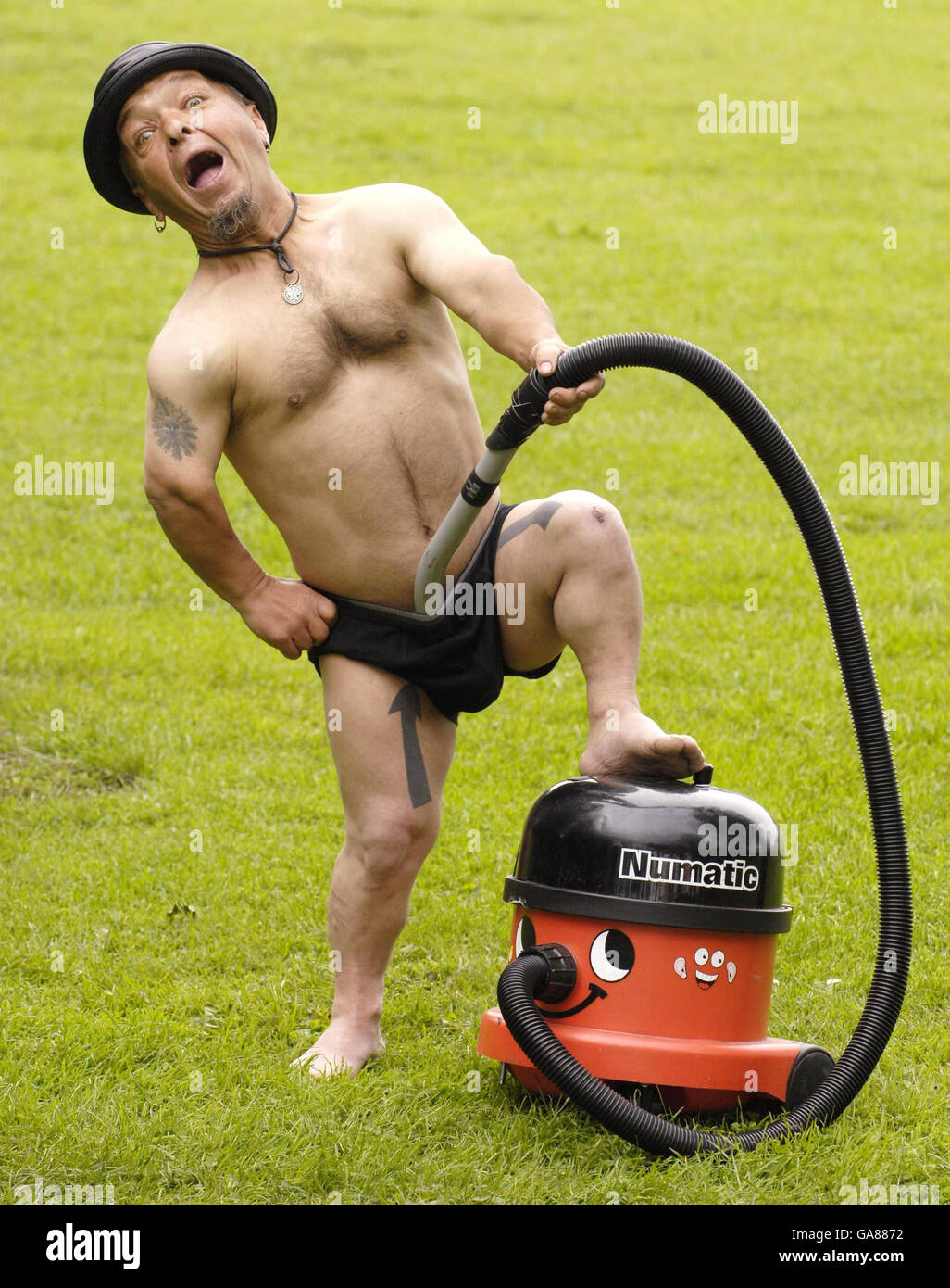 Performer's sticky situation with vacuum cleaner Stock Photo